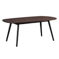 Moderne ovale eettafel met zwart metalen poten en een donkere houten bovenkant